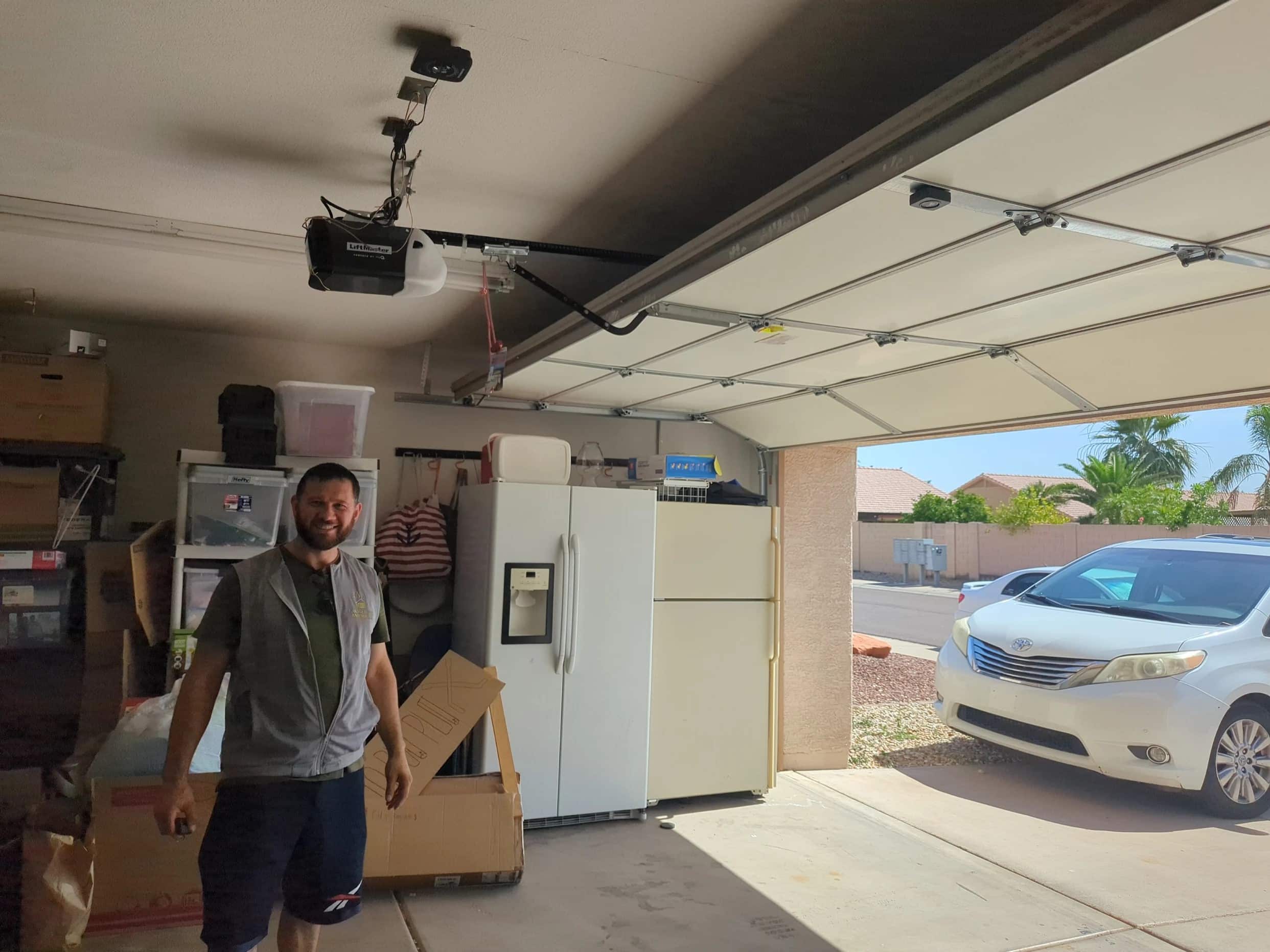 Eric from Glendale Garage Doors Pros standing by a garage door