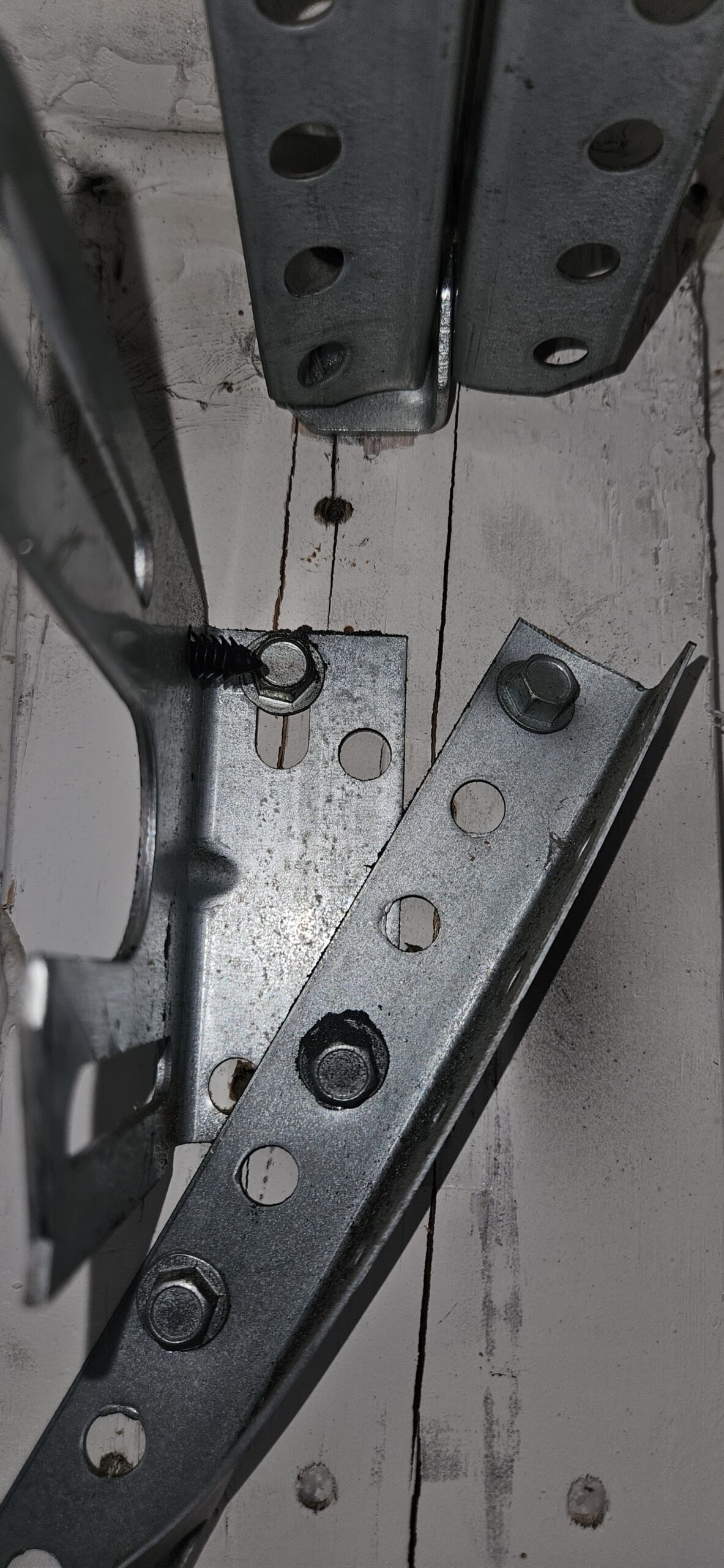 Cracked wood near old garage door bracket in Glendale