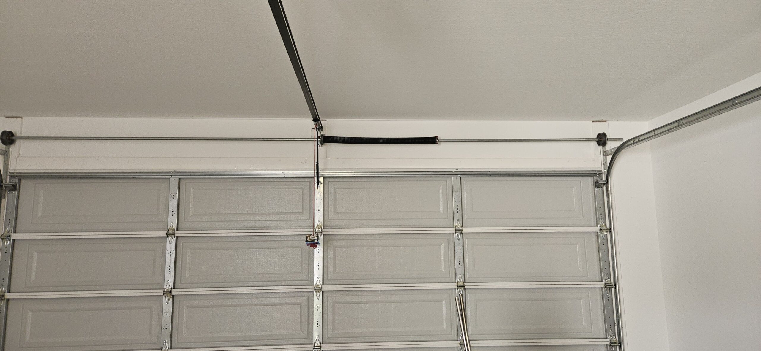 Garage door level and aligned after off-track repair on 181st Ave