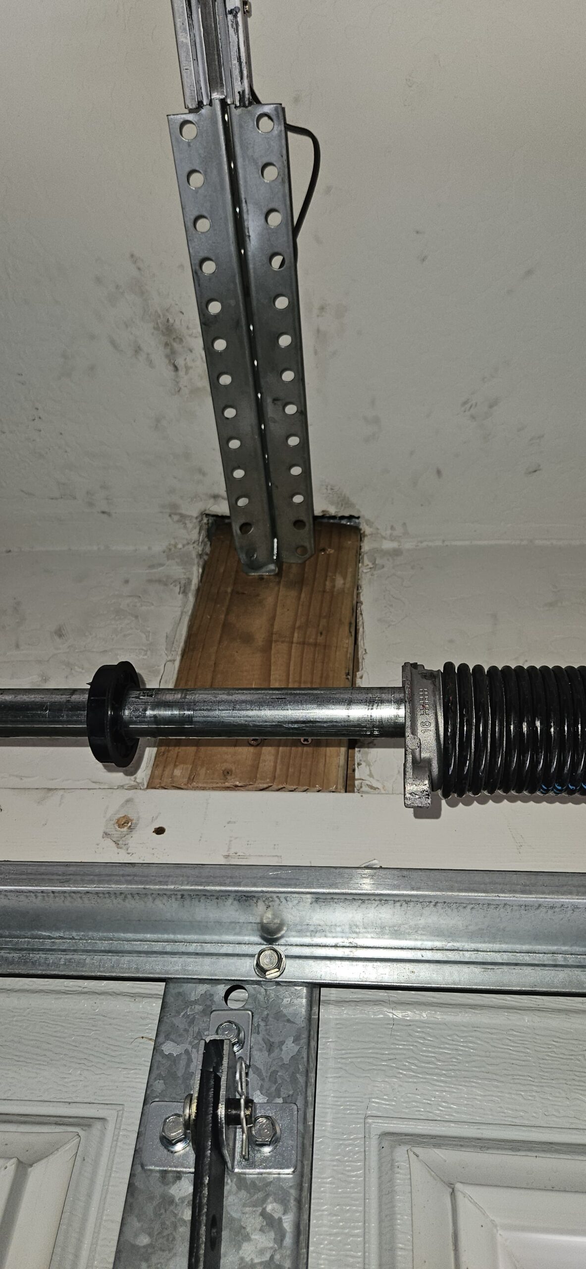 New garage door bracket installation in process