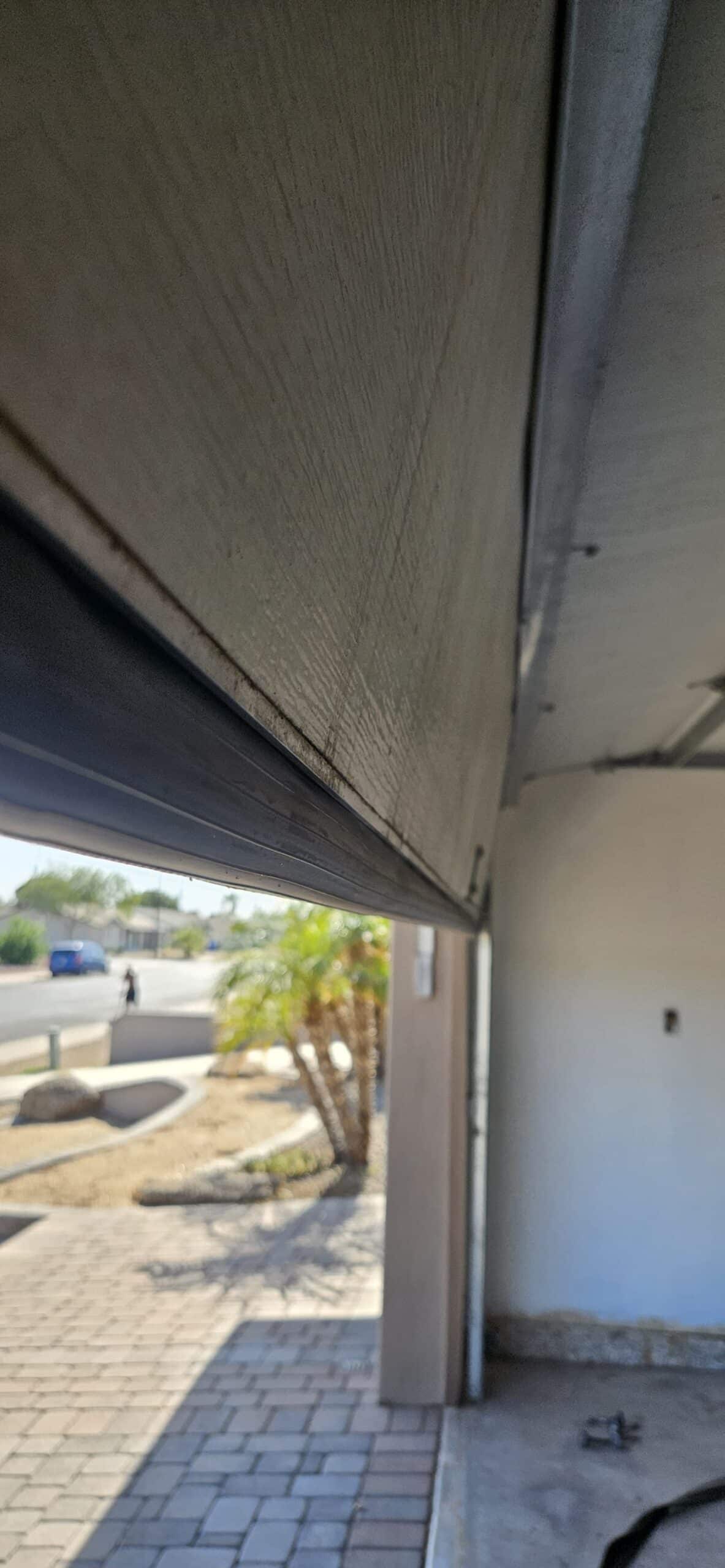 Worn garage door bottom seal before replacement
